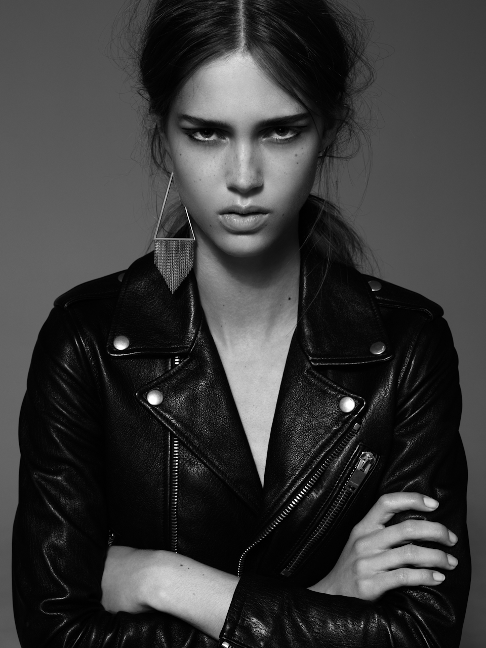 leather jacket and earring Saint Laurent by Hedi Slimane